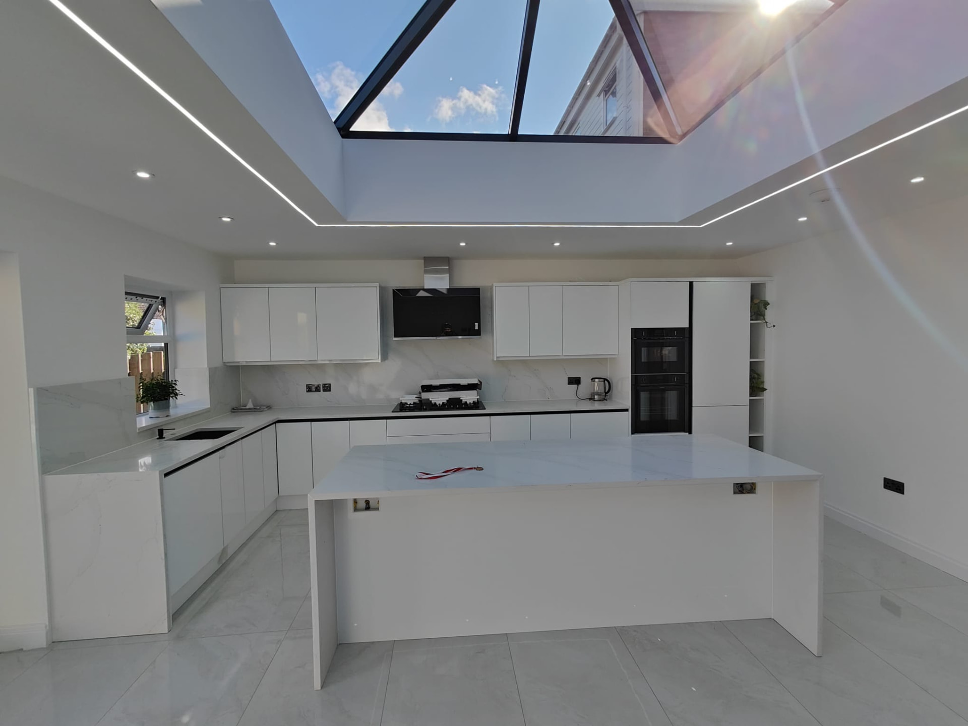 Sunlit finished kitchen with glass roof lantern and marble worktops, Leeds