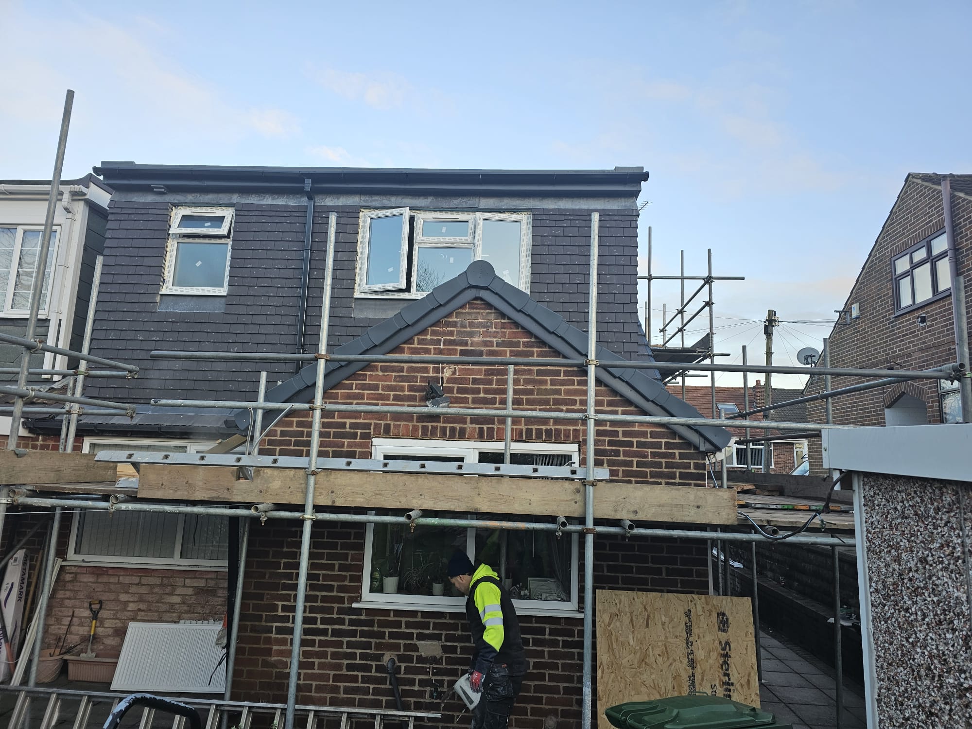 Rear of a Leeds home with a completed extension and remaining scaffolding