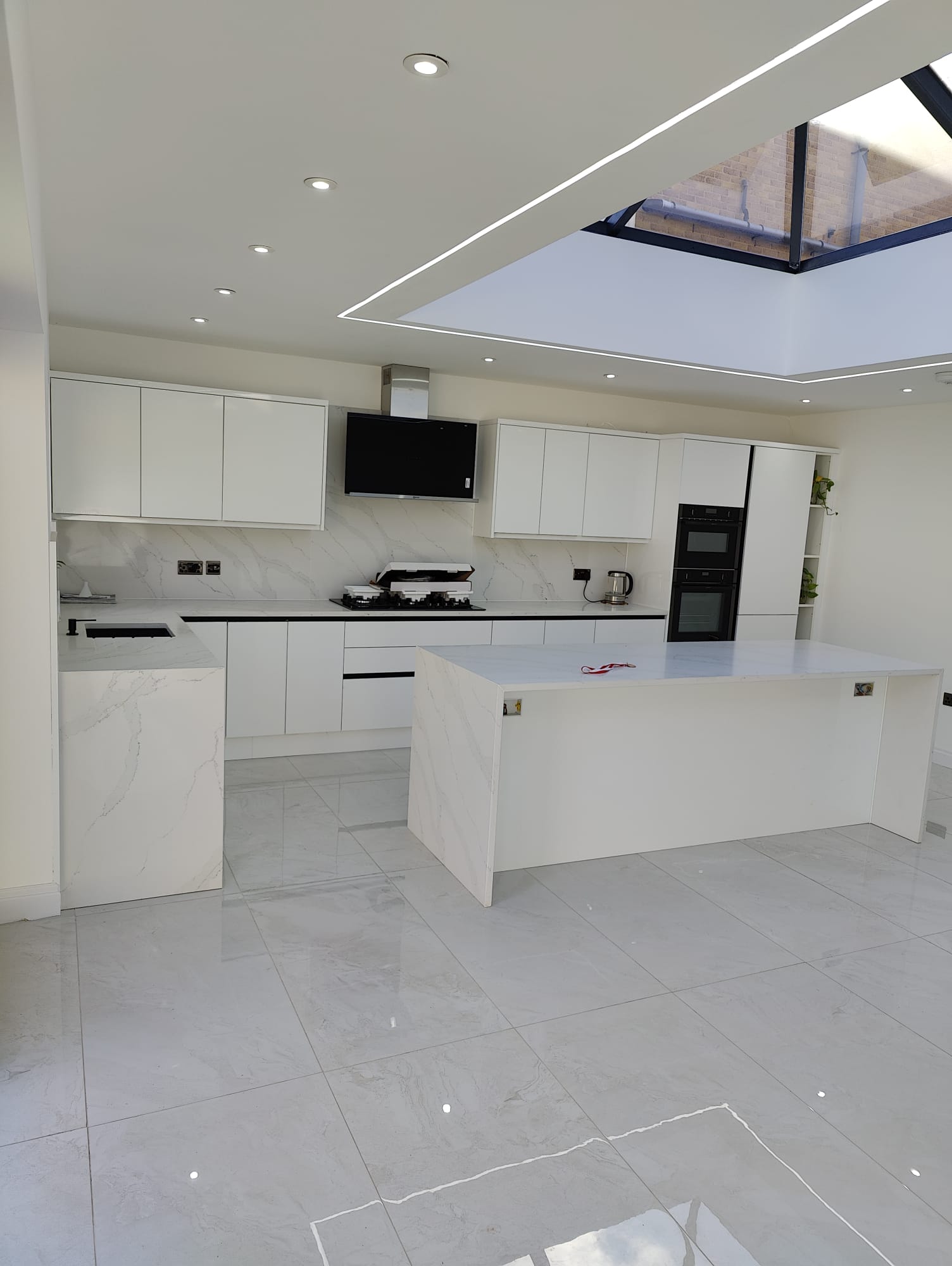 White marble kitchen fit-out with premium appliances, Leeds kitchen extension