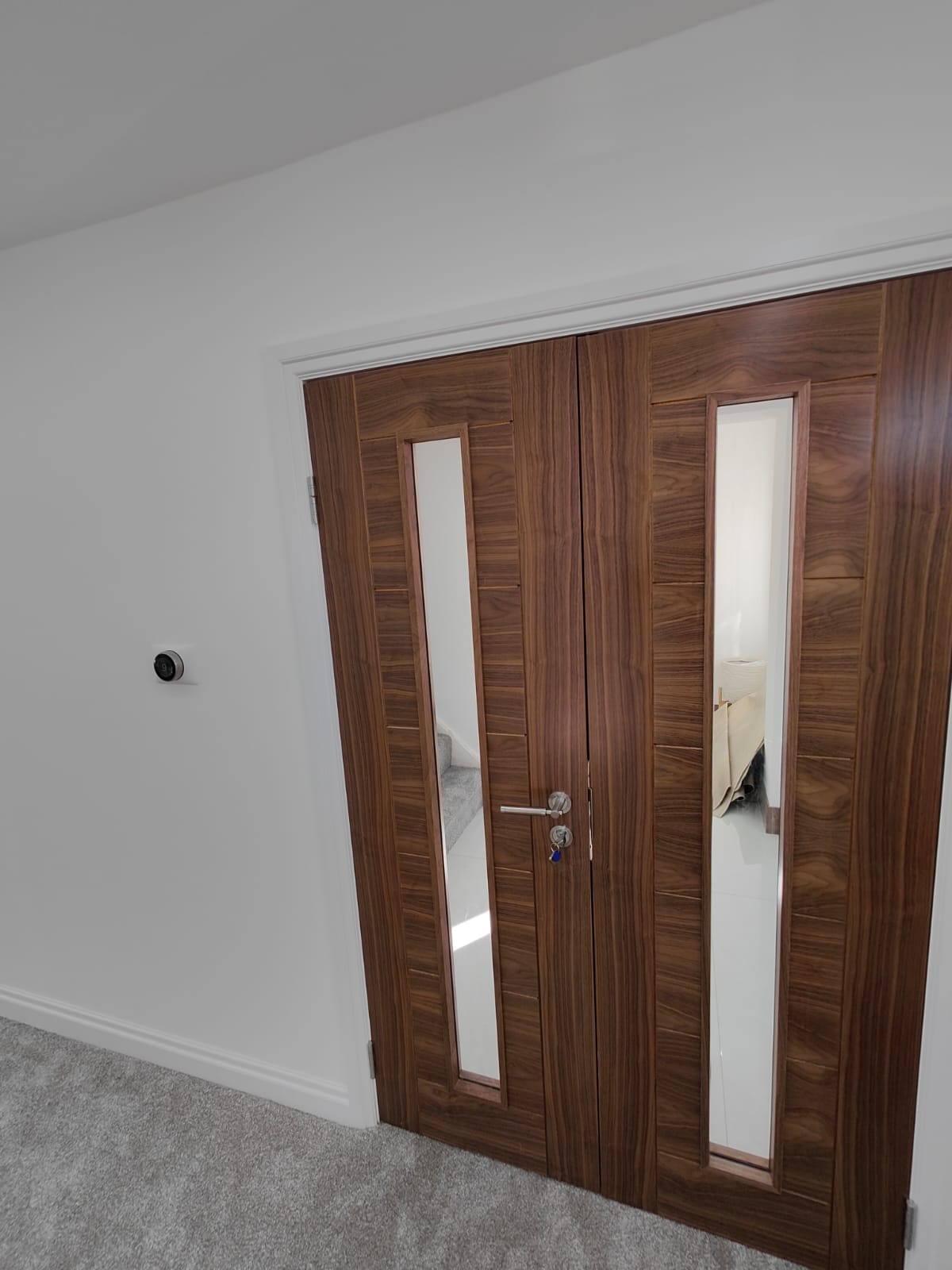Walnut double doors installed after plastering, Leeds home renovation