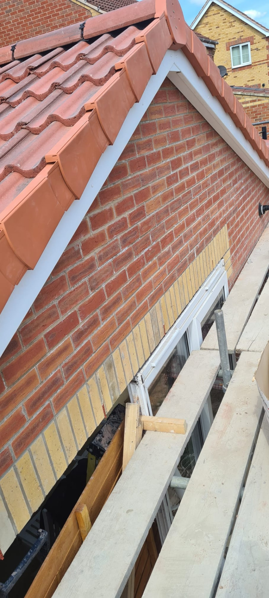 Terracotta roof verge and ridge detail during a Leeds re-roof