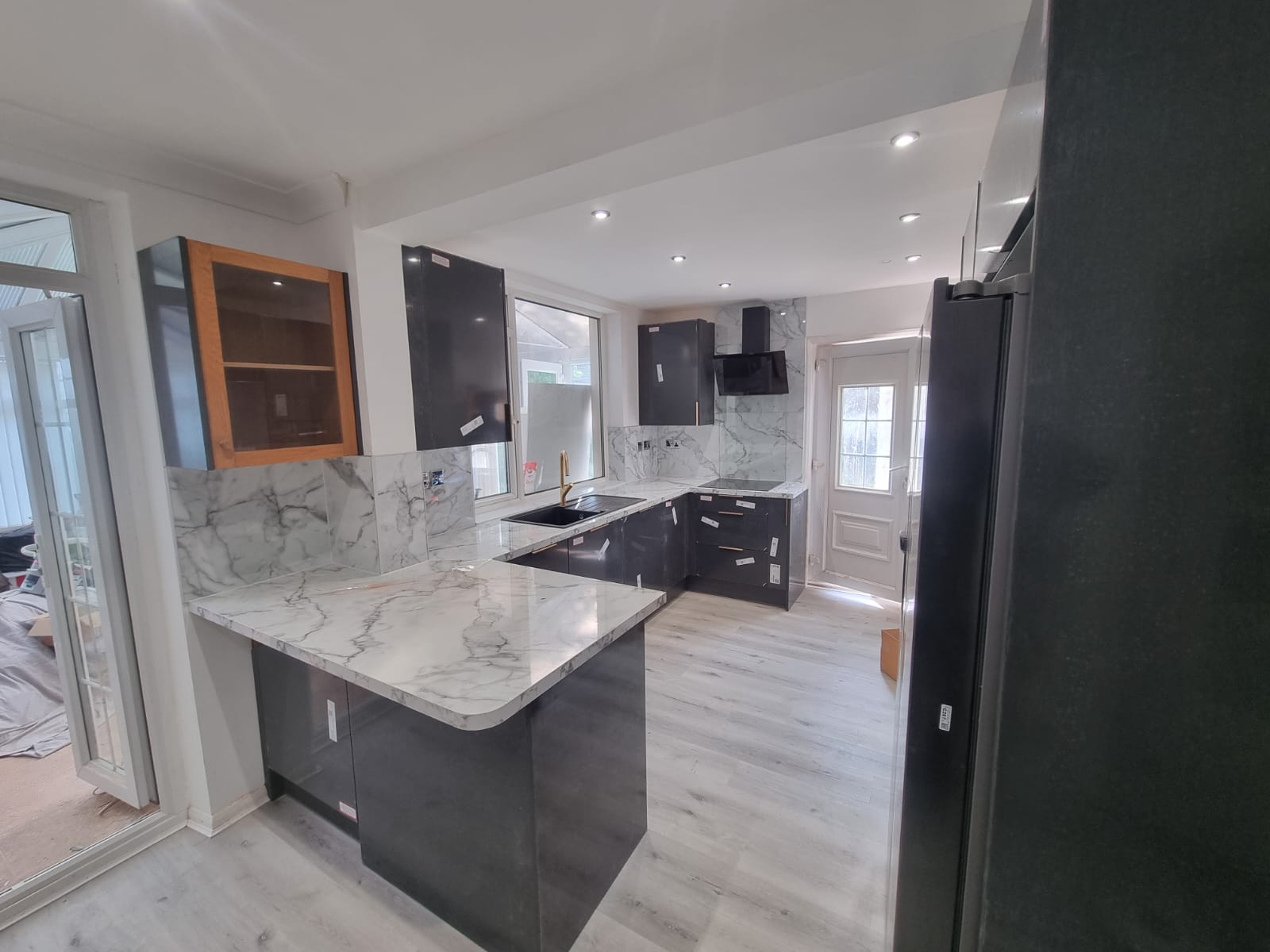 Finished dark grey kitchen with marble splashback, Leeds kitchen renovation