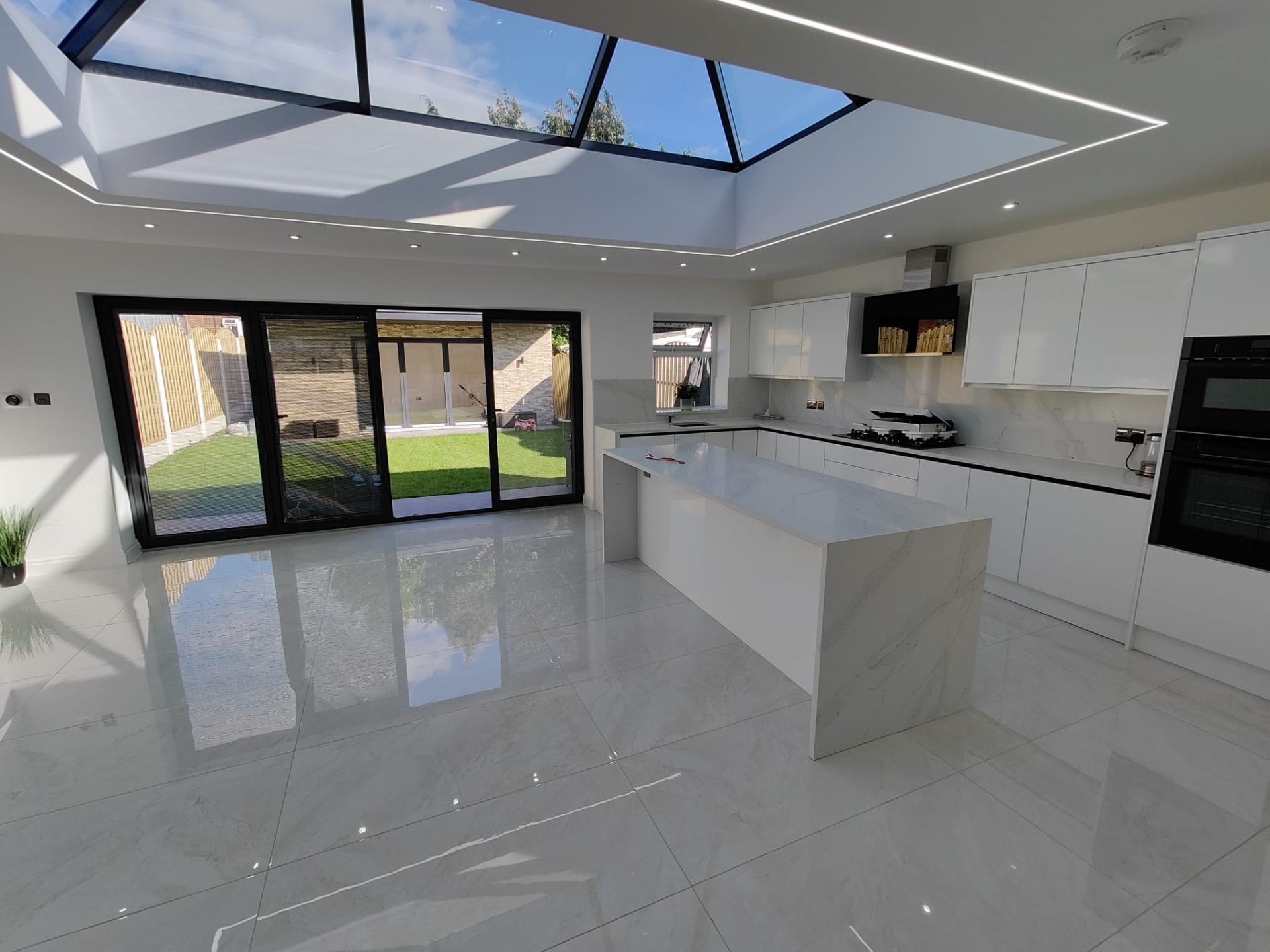 Bright kitchen extension with roof lantern and bi-fold doors, Leeds